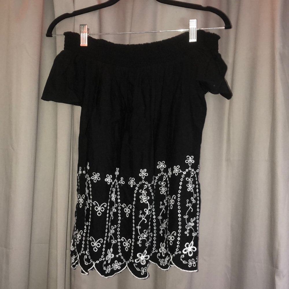Black off the shoulder top with flower detailing